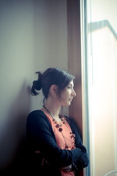 beautiful woman at home near window