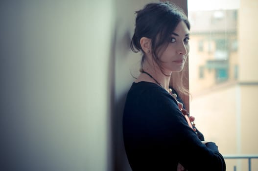 beautiful woman at home near window