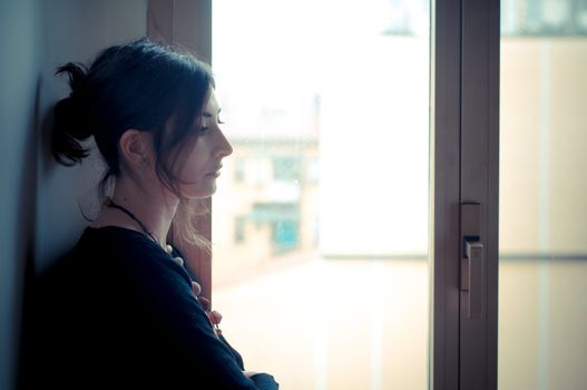 beautiful woman at home near window