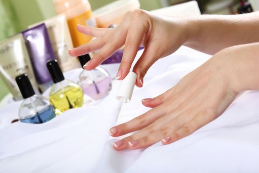 Female hands and manicure related objects in spa salon