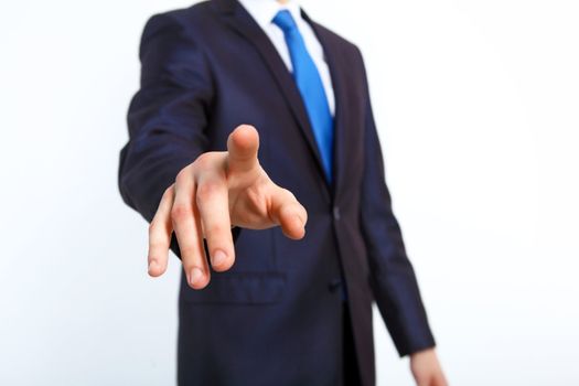 Business man in suit pushing a button with his finger