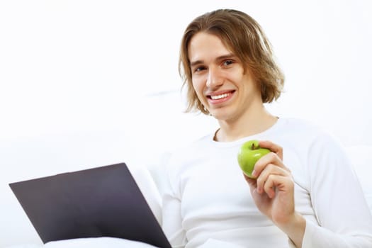 Portrait of a young man with notebook