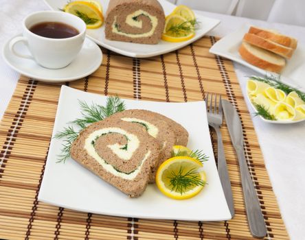 Slices of liver pate with butter and coffee for breakfast