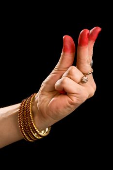 Woman hand showing Kangula hasta (hand gesture, also called mudra)  (meaning "Tail") of indian classic dance Bharata Natyam. Also used in other indian classical dances Kuchipudi and Odissi.