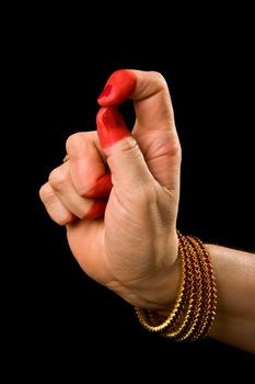 Woman hand showing Kapittha hasta (hand gesture, also called mudra) (meaning "Godess Lakshmi") of indian classic dance Bharata Natyam. Also used in Indian dances Odissi and Kuchipudi.
kapittha Godess Lakshmi