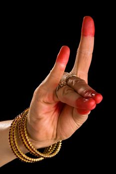 Woman hand showing Simhamukha hasta  (hand gesture, also called mudra)(meaning "Lion face") of indian classic dance Bharata Natyam. Also used in Indian dances Odissi and Kuchipudi.
