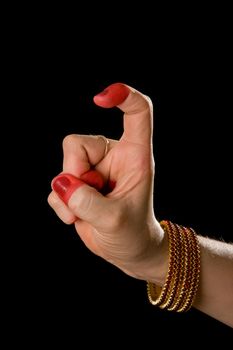 Woman hand showing Tamrachuda  hasta (hand gesture, also called mudra) (meaning "rooster") of indian classic dance Bharata Natyam. Also used in other indian classical dances Kuchipudi and Odissi.