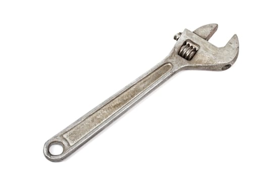 Old adjustable spanner isolated on white background