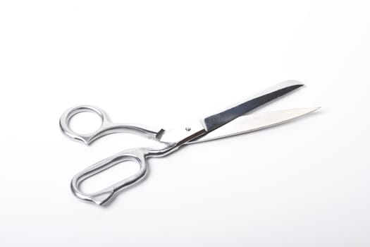 Tailor's scissors isolated on white background