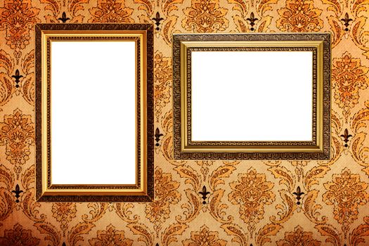 Vintage gold plated picture frames  on retro wallpaper background