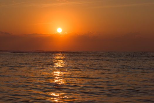 Calm ocean during tropical sunrise