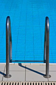 Metal ladder to swimming pool