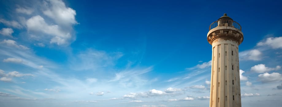 Old lighthouse in the blue sky