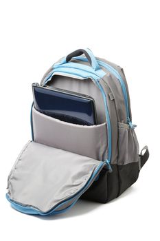 Backpack with a laptop inside isolated on white background