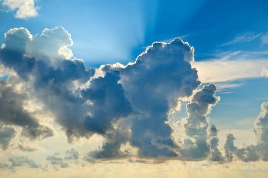 Clouds in sky with sunrays on sunrise