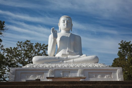 White sitting Budha image. Mihintale, Sri Lanka