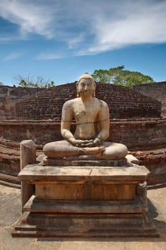 Ancient sitting Buddha image in votadage. Pollonaruwa, Sri Lanka