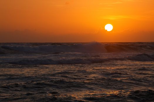 Ocean sunset  with large sun