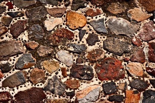 Texture of stone wall of ancient Mayan ruins in Mexico