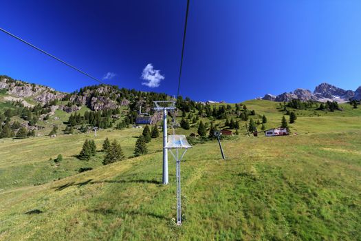 summer landscape of chairlift in alpine mountain,  Italy