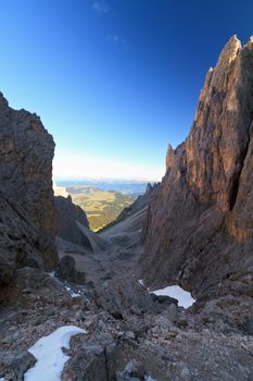 early morning on a gorge in Dolomites, Sassolungo mountain