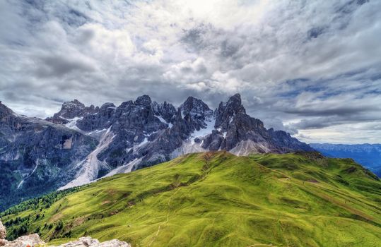 Pale San Martino against the sun from Rolle pass, Italian Dolomites - HDR image