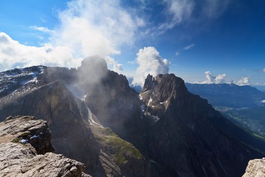 Pale di san Martino against the sun. View of Ball and Saas Maor mount from Rosetta peak, San Martino di Castrozza, Italy