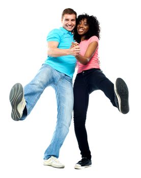 Dancing couple having fun. Showing legs to camera