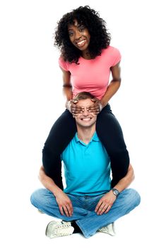 Playful couple having fun isolated against white background. Studio shot