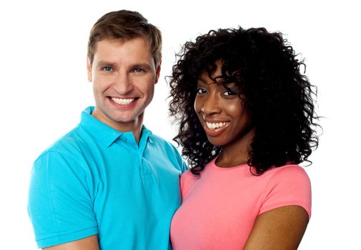 Happy young couple smiling in front of camera