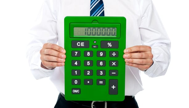 Closeup of a green calculator. Man holding with his hands