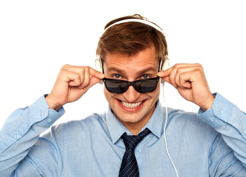 Musical guy peeping from sunglasses isolated against white background