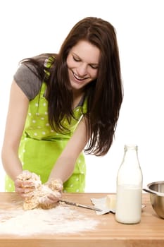 young baking woman forming dough with her hands on white background