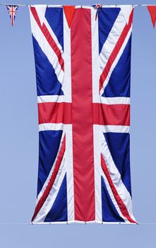 Union Jack flag, blue sky background