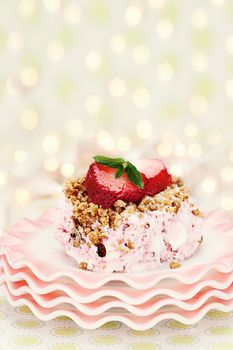 Frozen strawberry pie made with fresh strawberries and heavy whipping cream on top of vintage dishes. 
