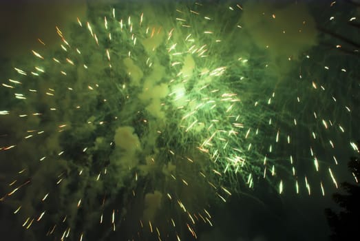 Colorful fireworks over dark sky, displayed during a celebration of Santa