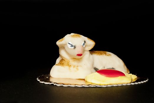 Homemade marzipan  Sheep cake, Easter cake typical in Sicily, isolated on black