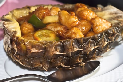 Chinese chicken sweet and sour sauce inside pineapple