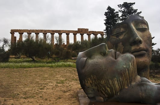 Greek temple of Agrigento with modern sculture. Sicily- Italy