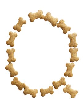 Letter Q made of bone shape dog food on white background, shot directly from above