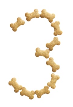 Number 3 made of bone shape dog food on white background, shot directly from above