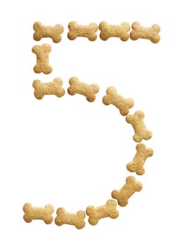 Number 5 made of bone shape dog food on white background, shot directly from above