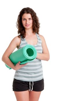 Woman holding a yoga mat, isoalated in a white background