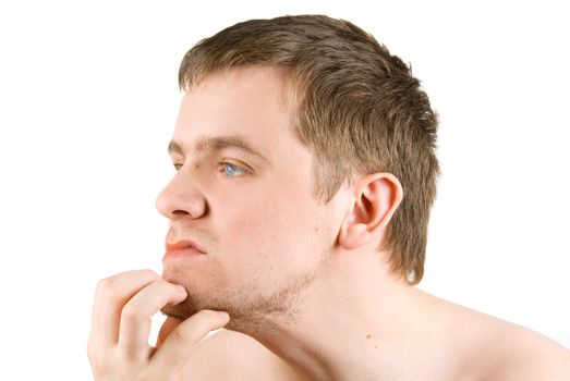 portrait of a thinking young man on white 