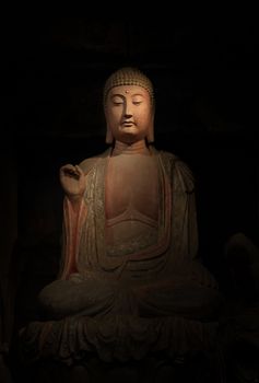 a buddha statue in temple in china