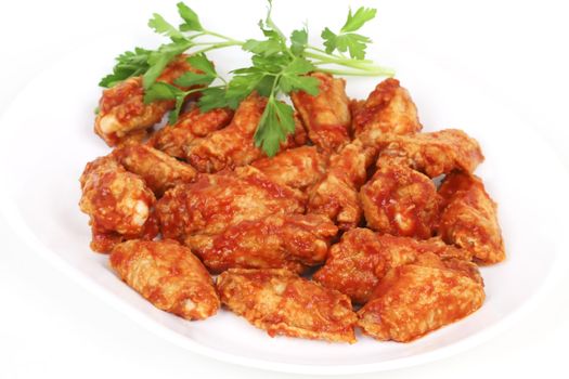 Chicken wings with hot spicy barbecue sause and celery