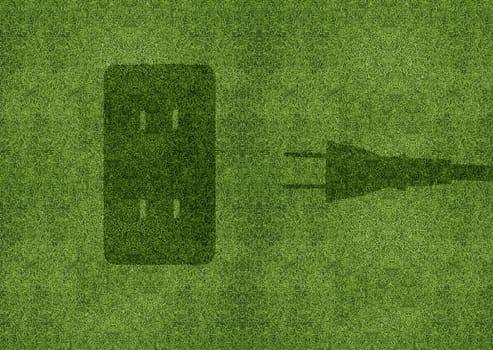 Green energy concept, Green power cord in electric outlet on a green grassland.