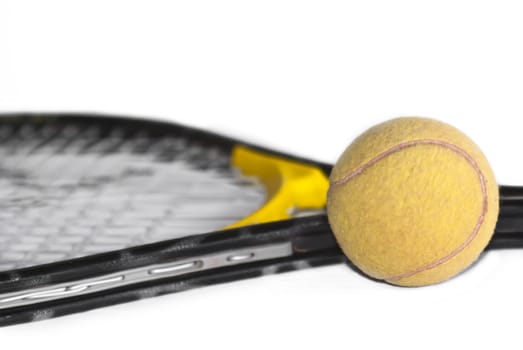 Tennis ball and racket isolated on white background