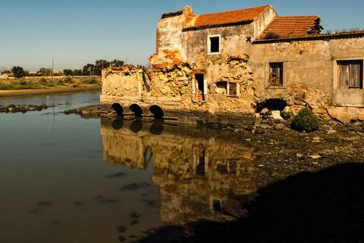 Ruins of a tide mill on the Tejo river.
