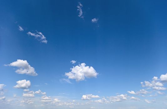 Summer blue sky with a few small clouds